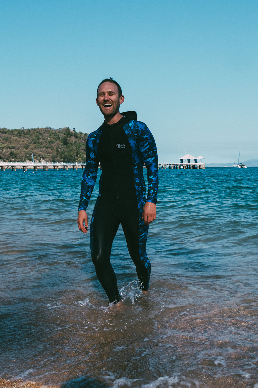 Male in a brave stingersuit in the ocean protected against jellyfish and the sun